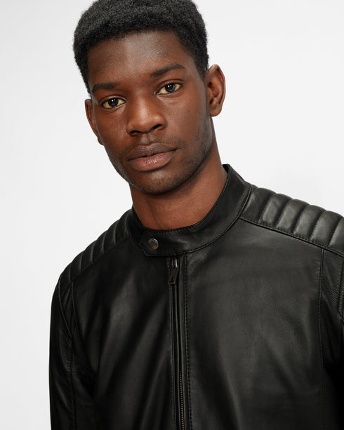 PAYPA-Outerwear-Perfect for weekends or evenings out, the PAYPA jacket is sure to become a permanent fixture in any gent's wardrobe. Crafted in luxurious leather and fully lined with branded Ts, the button collar on the neck lends a unique finish to the style. Leather Zip fastening Internal pocket Quilted detail on shoulders Fully lined Side pockets Button detail on neck and sleeve Our model is 6'2" 1.87m and wears a Ted size 3- Ted Baker Romania